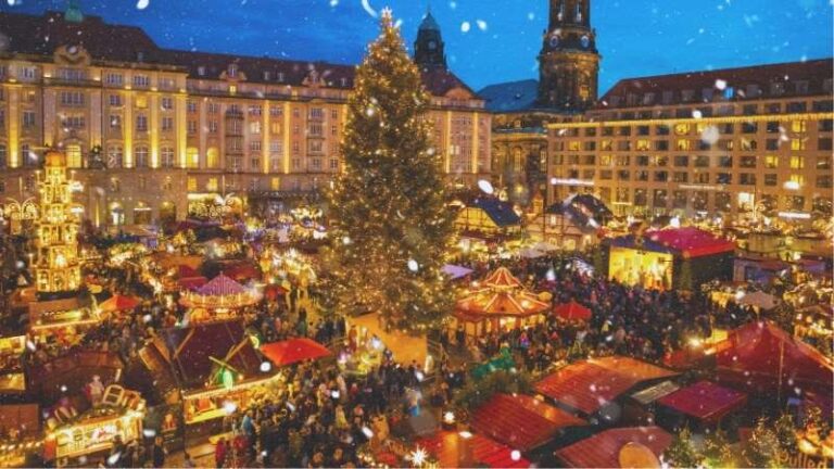 People Visit Christmas Market Striezelmarkt in Dresden, Germany